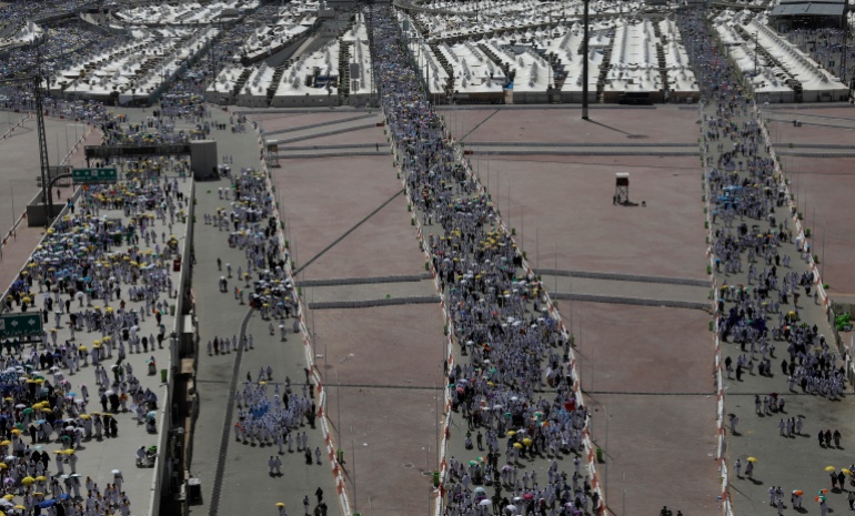 Muslim pilgrims walk to cast their stones at a pillar symbolising the stoning of Satan during the annual haj pilgrimage in Mina, Saudi Arabia August 11, 2019. REUTERS/Umit Bektas