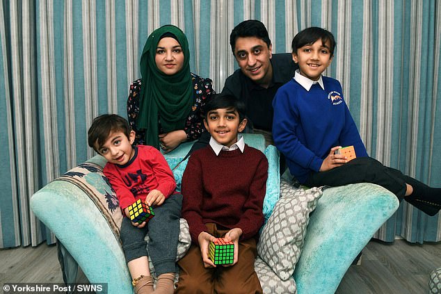 Yusuf celebrated the amazing achievement with a meal at Nando's with his parents Sana and Irfan and two younger brothers Zaki (left) and Khalid (right)
